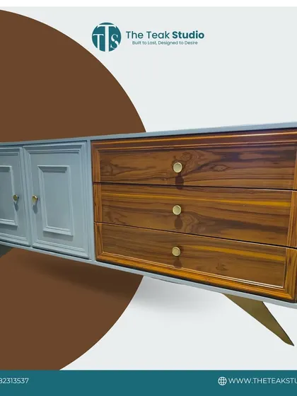 This dual-tone cabinet showcases a beautiful contrast between classic panelled doors in a soft grey finish and natural teak wood drawers. The elegant legs and simple hardware complete the transitional design.