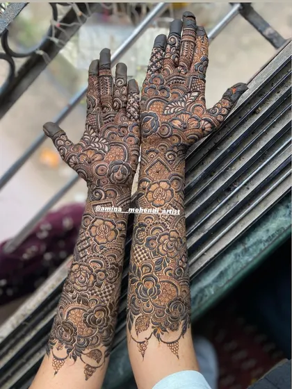The back of a full bridal design, showcasing the intricate patterns that cover the arms from wrist to elbow.