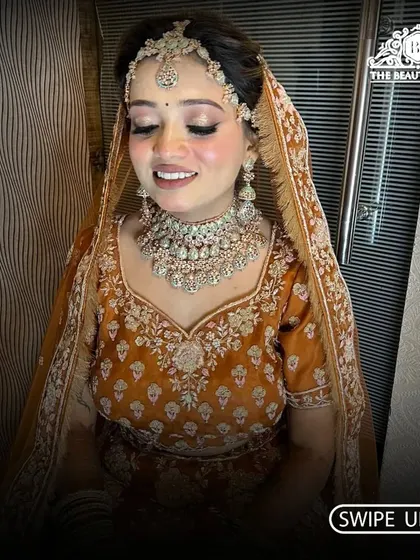 This shot captures the beautiful smile of the bride. Her makeup is subtle yet defining, letting her natural beauty shine through.