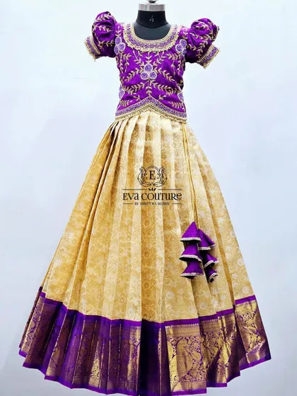A variation of the embroidered purple blouse, paired here with a cream-colored skirt to show its versatility.