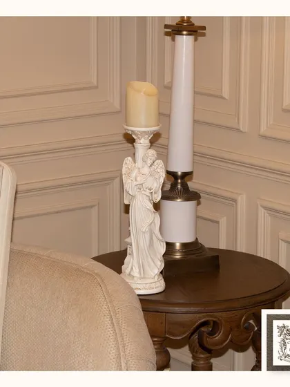 This Victorian-style candle stand, featuring a serene angel figure, adds a touch of grace and soft light to a cozy corner. It's a beautiful piece for creating a peaceful and elegant ambiance.
