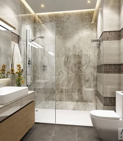 A contemporary bathroom design with textured wall tiles and a floating wood vanity. The walk-in shower with a glass enclosure creates a sense of spaciousness.