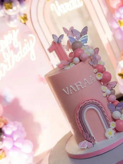 I love how the colors of the cake matched the balloon arch perfectly.