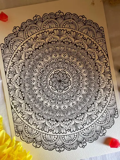 The future belongs to those who believe in the beauty of their dreams. This A4 mandala has a beautiful, lace-like quality, with delicate loops and fills.