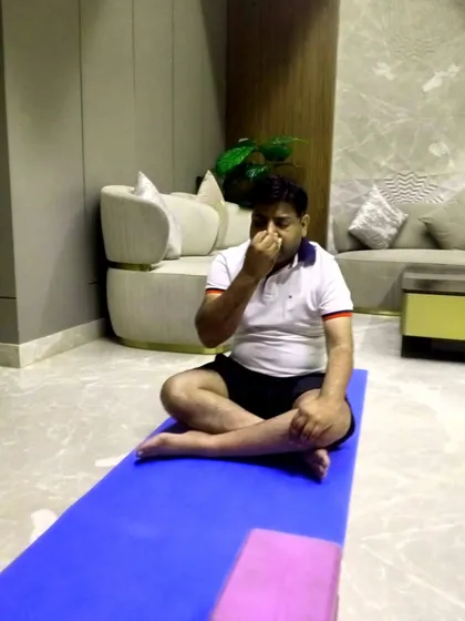 A quiet moment of pranayama practice during a busy workday. I teach techniques like Nadi Shodhana to help employees clear their minds and reduce stress at their desks.