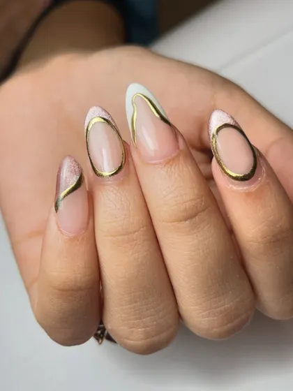This shot shows the intricate gold chrome lines on each nail, creating a cohesive yet unique design across the entire set.