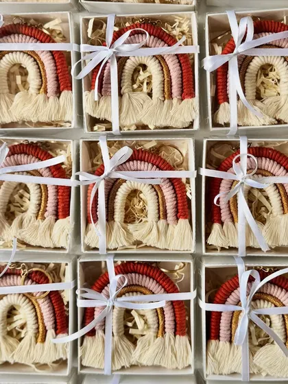 I believe presentation is part of the gift. Here are my handmade rainbow keychains, each nestled in a box with a ribbon, ready to be given as beautiful return favors for a special event.