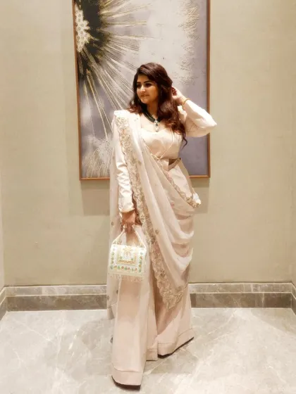 My approach to style is about expressing your authentic story. This powder peach powersuit, paired with a traditional zardozi dupatta, is a perfect example of fusion power dressing. It's not about following trends, but about creating a look that resonates with your personality and presence.