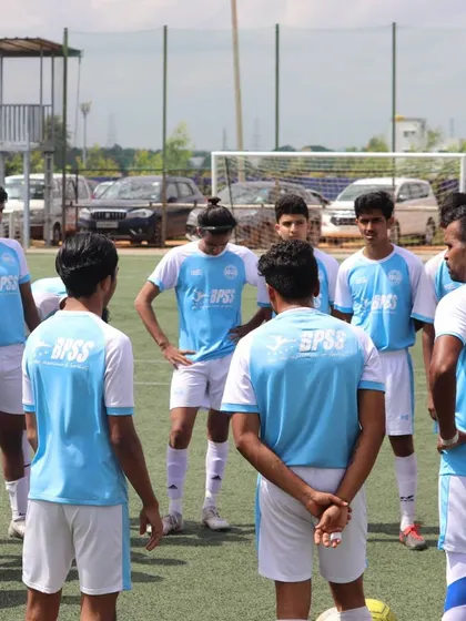 A team huddle during a training session. This is where I give instructions and players share feedback to improve their collective performance.