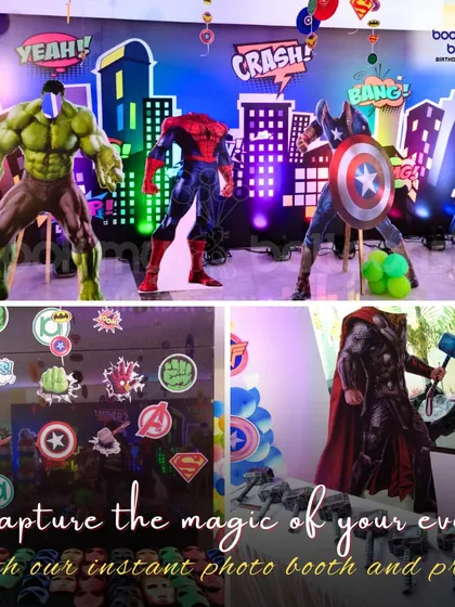 A superhero party setup featuring life-sized statues of the Hulk, Spiderman, and Captain America, along with a themed photo booth and props for capturing heroic moments.