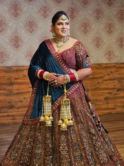 Another full-length view, showing the grand embroidery of the lehenga and how the makeup brings the whole look together.