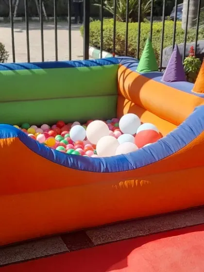 A clean and ready-to-use inflatable ball pool with soft, conical play shapes inside. I ensure all equipment is sanitized and in excellent condition.