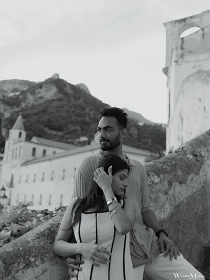 A quiet, contemplative moment for Nisarg and Mansi along the Amalfi Coast. This black and white photograph captures a sense of timelessness and the deep bond they share.