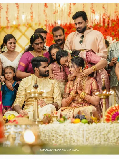A heartwarming moment of family members blessing the couple during their wedding ceremony.