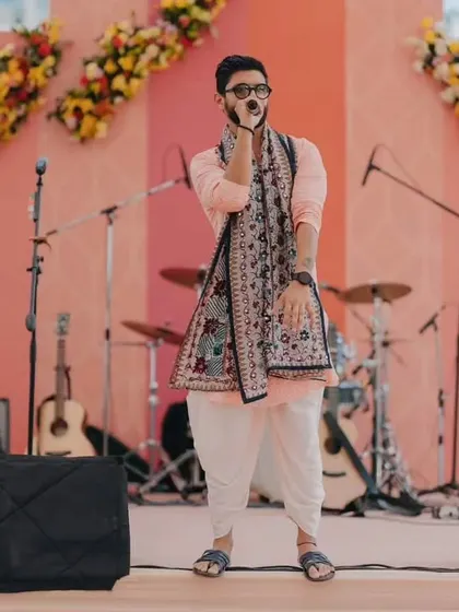 A playful "Jai Mata Di" pose. It's a fun, candid moment that connects with a wide audience.