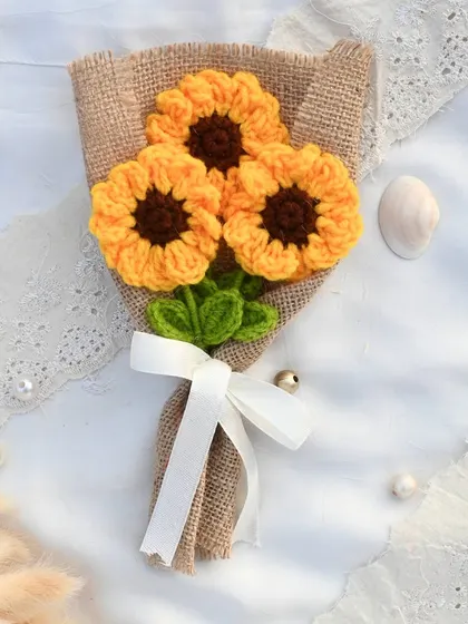 A rustic and charming bouquet of three handmade crochet sunflowers, wrapped simply in jute to highlight their natural beauty.