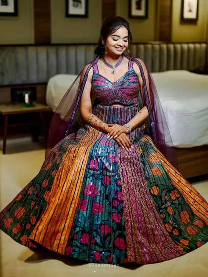 The joy in her smile says it all. Shloka's colorful sangeet glam was designed to be as happy and vibrant as she is.