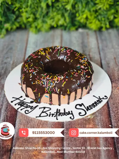 A cake that looks like a giant donut! This fun chocolate-drizzled donut cake is perfect for someone who loves unique and playful desserts.