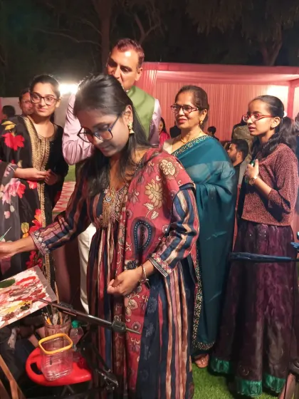 Guests of all ages are drawn to the live painting. It becomes a talking point and a memorable part of the event, as seen here at this wedding in Civil Lines, New Delhi.