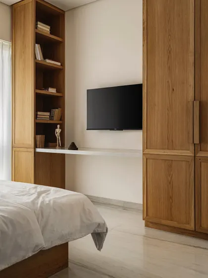 The bedroom in Apartment 1005 includes a custom-built wooden wardrobe and a floating desk, creating a functional and seamless look.