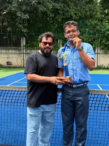 Celebrating with Taanishq Mandaliya from the silver-medalist Boys Under-19 team at the CBSE Cluster Championship. His performance was crucial for the team's success.