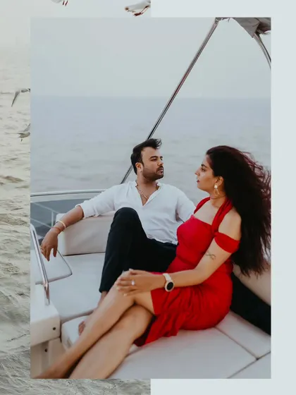 A stylish couple portrait from a luxury pre-wedding shoot on a yacht off the Mumbai coast. The wind and open sea provide a perfect, dynamic backdrop for your story.