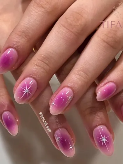 A top-down view of the pink gradient nails, showing the delicate sparkle and flawless finish.