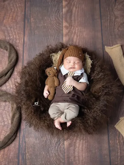 Oh boy. A creative shot using props to spell out the word 'BOY' around the sleeping newborn.