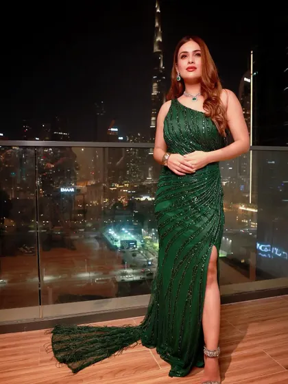 A glitter and glam look I styled for Neha Malik for an event in Dubai. This emerald green sequin gown with a dramatic train was perfect for a night out, set against the stunning backdrop of the Burj Khalifa.