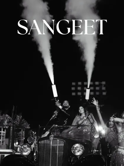 Let's make your Sangeet entry unforgettable. For this couple, I arranged a classic vintage car and equipped them with CO2 smoke jets for a high-energy, show-stopping arrival. It’s all about creating moments that match your personality and get the party started right.