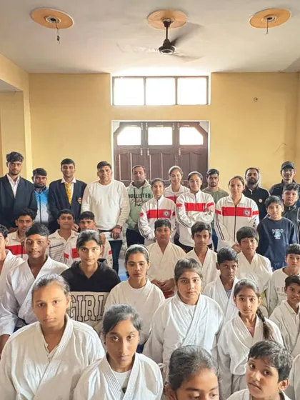 A group photo of the competitors, showing the range of students from different belt levels.
