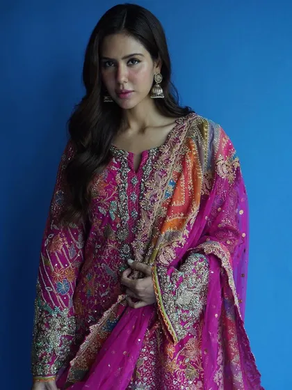 Another angle of this gorgeous Rimple and Harpreet creation on Sonam Bajwa, showing the flow of the dupatta and the rich colors of the embroidery.