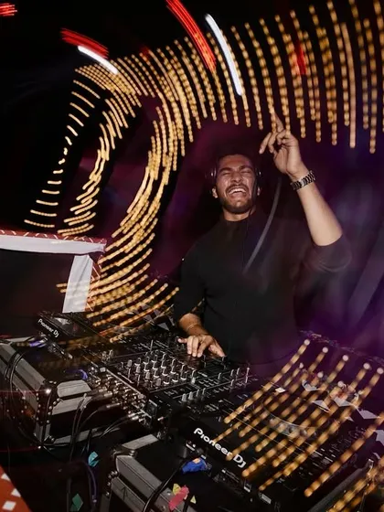 A shot from a fantastic wedding afterparty in Goa. I use creative lighting and a dynamic setlist to make sure the celebration is visually stunning and keeps everyone dancing all night. This is what a professional wedding DJ set looks like.