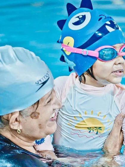 A mother and child enjoy a moment in the pool. Our program encourages parents to be a part of their toddler's swimming journey.