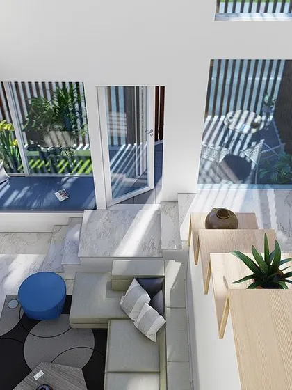 A top-down view of the sunken living area and double-height space. This perspective shows how the different levels and elements connect, creating a dynamic and unified interior.