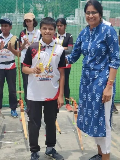 That proud moment when you receive your first archery medal. This is what it's all about, celebrating milestones and building confidence.