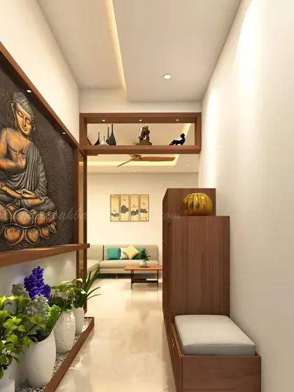 A tranquil and nature-inspired foyer. This design features a large Buddha wall mural and a long planter box, creating a peaceful corridor that leads into the home. A small bench and shoe cabinet are neatly integrated.
