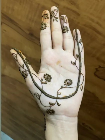 A close-up of the minimal vine design, showing its delicate and graceful lines.