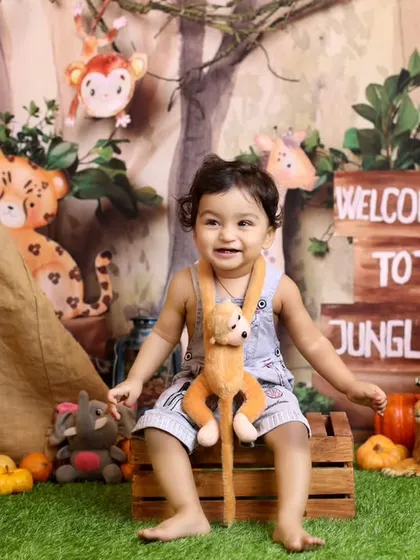 Welcome to the jungle! This fun safari-themed toddler shoot is filled with friendly stuffed animals, a canvas tent, and lush greenery for a wild adventure.