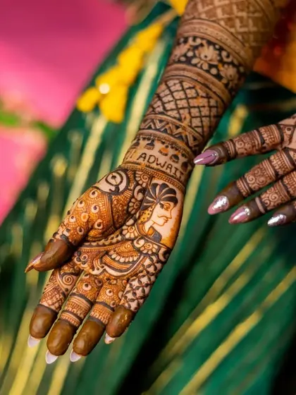A detailed photograph of the bride's full mehendi design, showcasing the incredible artistry from the palm to the elbow.