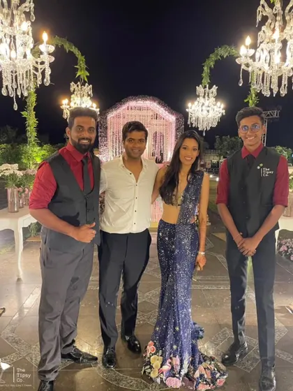 Our bartenders posing with the happy hosts of a wedding celebration. Building great relationships with our clients and their guests is what we do best.