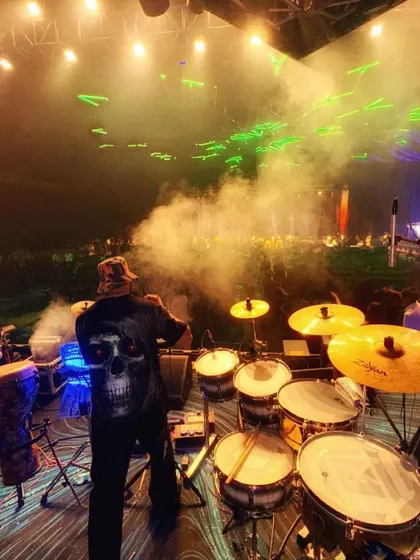 A view from my console. This is my zone, surrounded by my full drum and percussion kit, with smoke and lasers filling the air. This setup allows me to bring a stadium-level concert feel to your event.