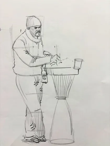 A quick gesture sketch of a man standing at a table, an exercise in capturing poses quickly.