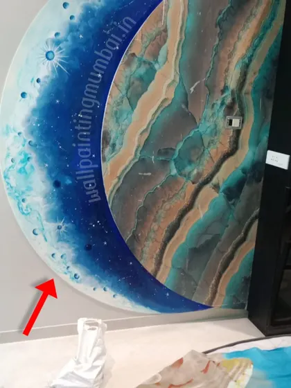 This is a close-up of a Blue Moon mural I created with special embossed effects. The raised textures add a tactile, 3D quality to the painting, making the celestial design even more captivating and unique.