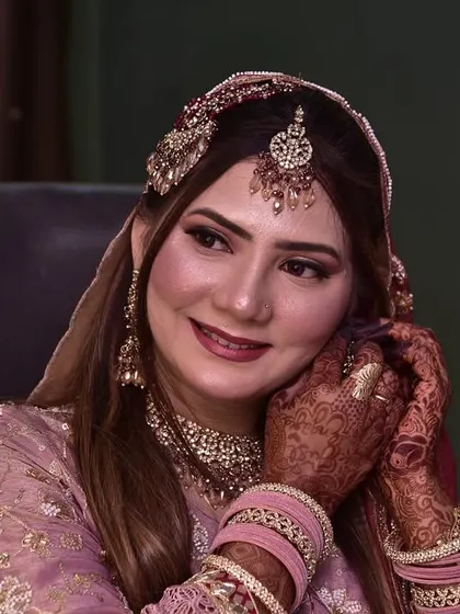 A happy and radiant engagement bride, ready to celebrate. Her smile shows her confidence and joy in her final look.