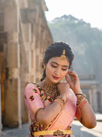 Another beautiful shot from the same pre-wedding shoot, showing the hairstyle and saree in a different pose.