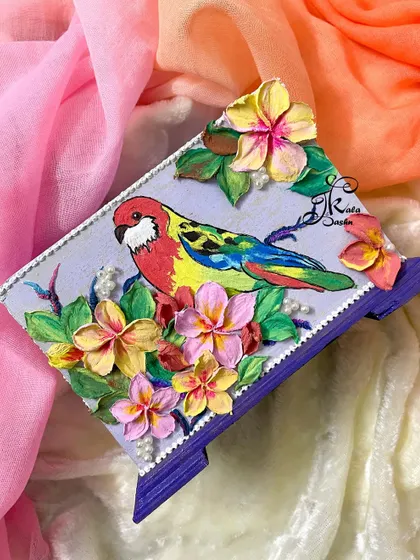 The macaw utility stand displayed against a colorful background, highlighting its tropical theme.