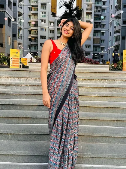 My daughter celebrating Women's Day in one of my creations. This printed saree-style dress is a modern take on ethnic wear.