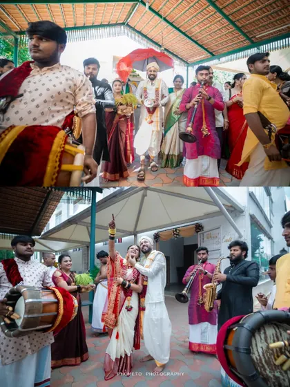 The couple's grand entrance with a band, capturing the festive and celebratory spirit of an Indian wedding.