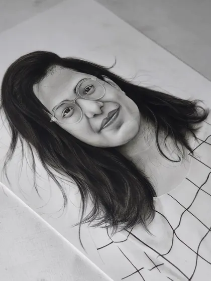 A portrait of a woman with glasses.